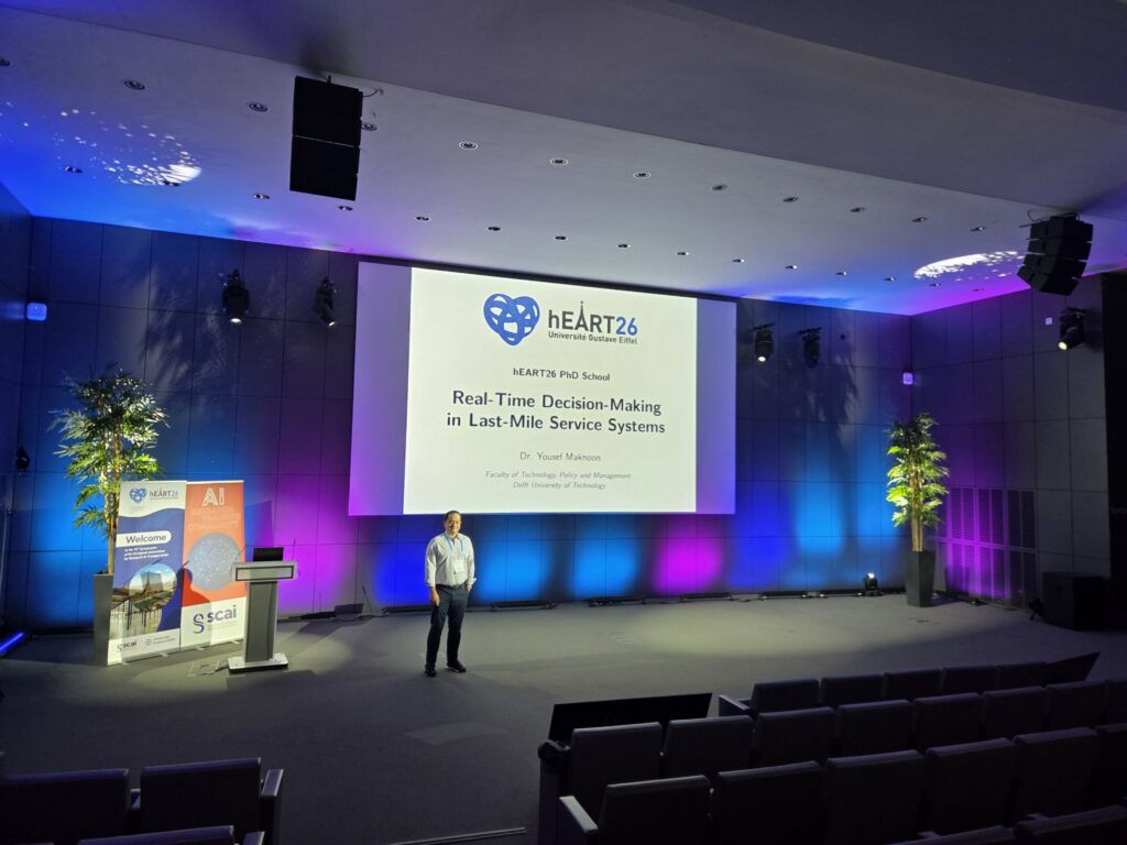 Yousef Maknoon presenting a hEART 2026 PhD School session on real-time decision-making in last-mile service systems.